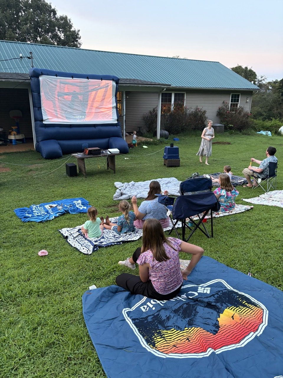Families and parishioners gathered for an outdoor movie night.